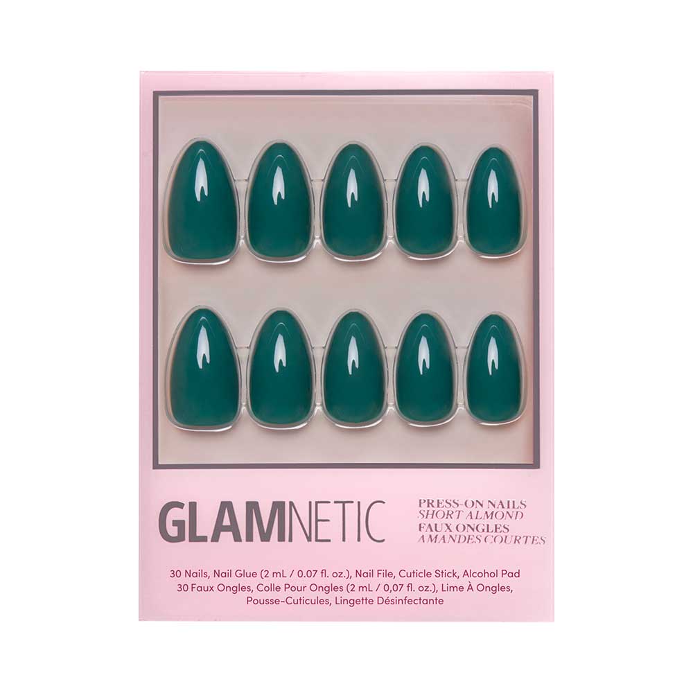 A box of glamnetic Emerald Green press-on nails in a glossy short almond shape, arranged in two rows with a pink border and product details on the packaging.