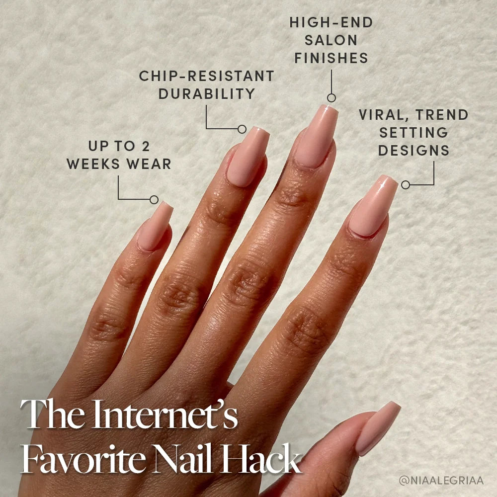 A hand with long, coffin-shaped pinky nude nails wears Exposed by glamnetic. Enjoy up to 2 weeks of chip-resistant, salon-quality wear with viral, trend-setting designs—the internet’s favorite nail hack!.