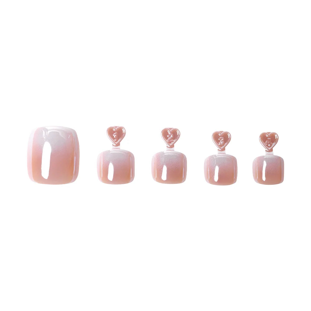 Iridescent light pink press-on toenails with a pearlescent sheen, arranged in a gradient of sizes with heart tabs for application