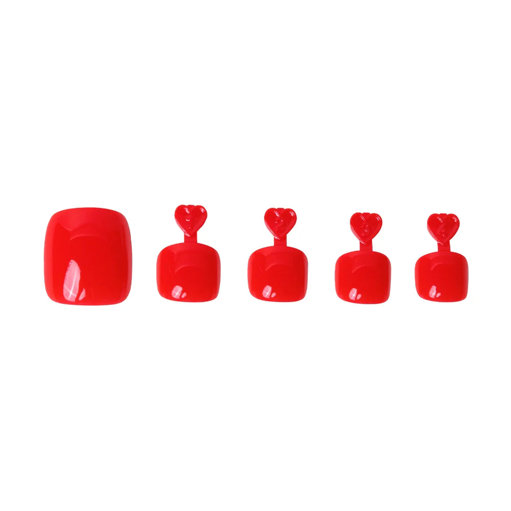 Glossy bold red press-on toenails in five sizes, each with heart-shaped tabs for application.