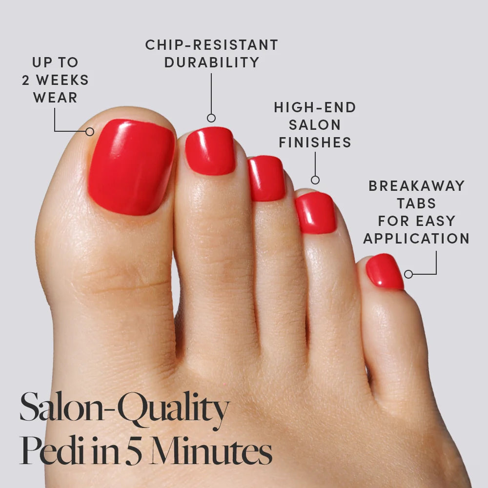 A bold red set of Glamnetic press-on toenails on a foot, described with durability and salon-finish benefits.