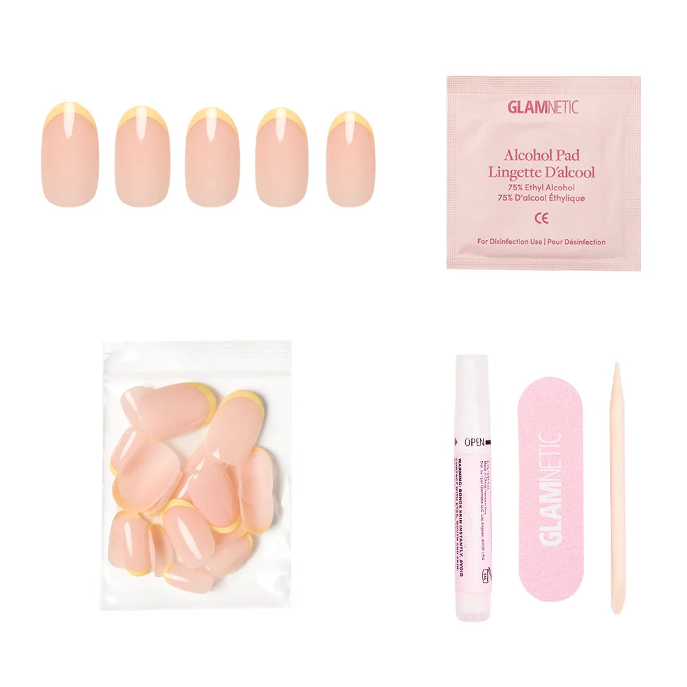 The glamnetic French Butter Press-On Nail Set includes five nude nails with pastel yellow French tips, extra nails, an alcohol pad, nail glue, a pink file, and a wooden cuticle stick for salon-quality durability.
