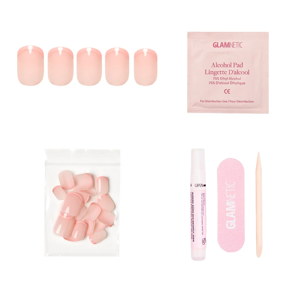 The glamnetic French Peach set includes vegan, cruelty-free pink press-on nails, an alcohol pad, extra nails, a glue pen, a pink nail file, and a wooden cuticle stick—all displayed on a white background.