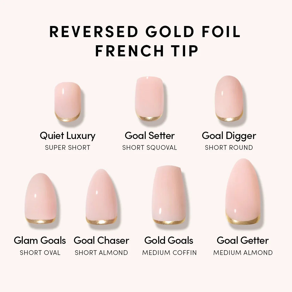 The glamnetic Glam Goals set features seven pale pink press-on nails with reversed gold foil French tips in various lengths and shapes, including short ovals like Quiet Luxury (super short) and Goal Getter (medium almond), each uniquely named.