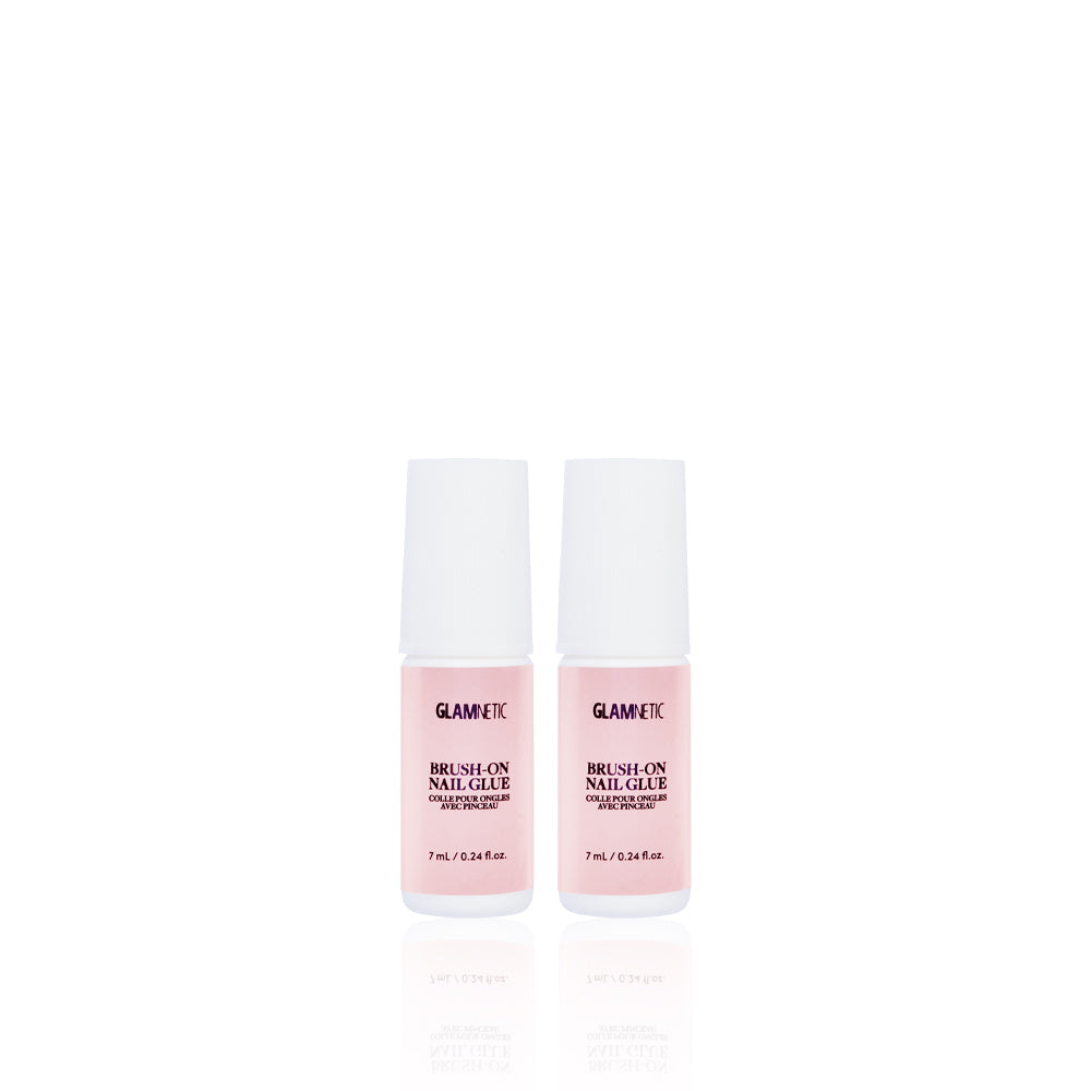Two small pink bottles of glamnetic Glue Duo with white caps stand side by side on a white background. Labeled in black text, they’re perfect for salon-style nails.