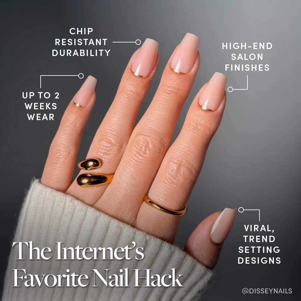 A hand with long, pale pink "Gold Goals" coffin nails by glamnetic and gold rings displays key features: salon-quality, chip-resistant durability, up to 2 weeks wear, luxe finishes, and viral trend-setting designs.