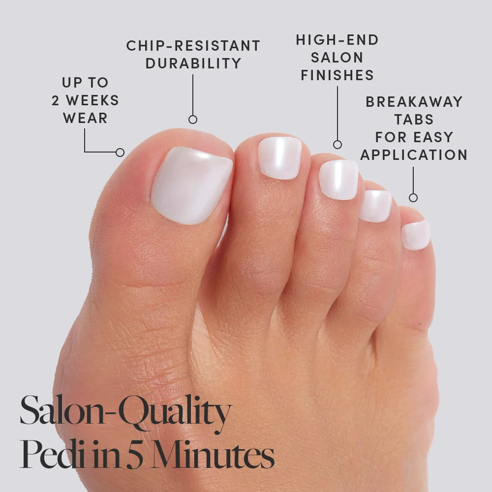 A foot wearing pearly white Glamnetic press-on toenails with product features called out, including salon finish and 2-week wear.