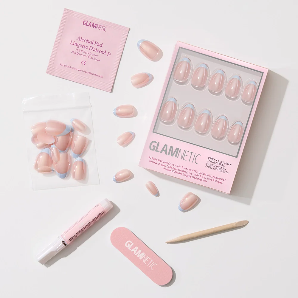 Into Blue by glamnetic: salon-quality press-on nails with pink and periwinkle micro French tips. Set includes nail file, cuticle stick, nail glue, alcohol pad & extra nails—all shown on a white background.