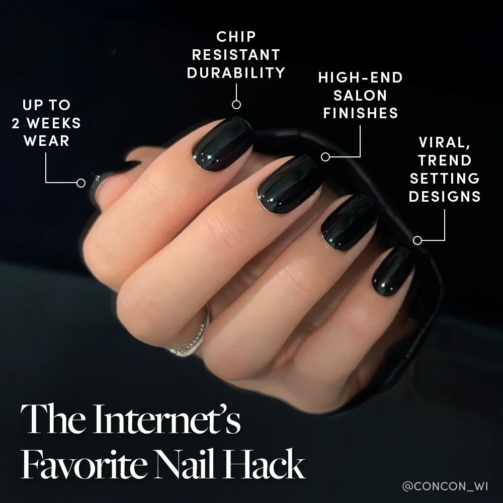 A hand with glossy black, perfectly polished nails holds a black sleeve. Featuring the glamnetic Jet Black: up to 2 weeks wear, chip-resistant durability, high-end finishes, and viral, trendsetting designs.