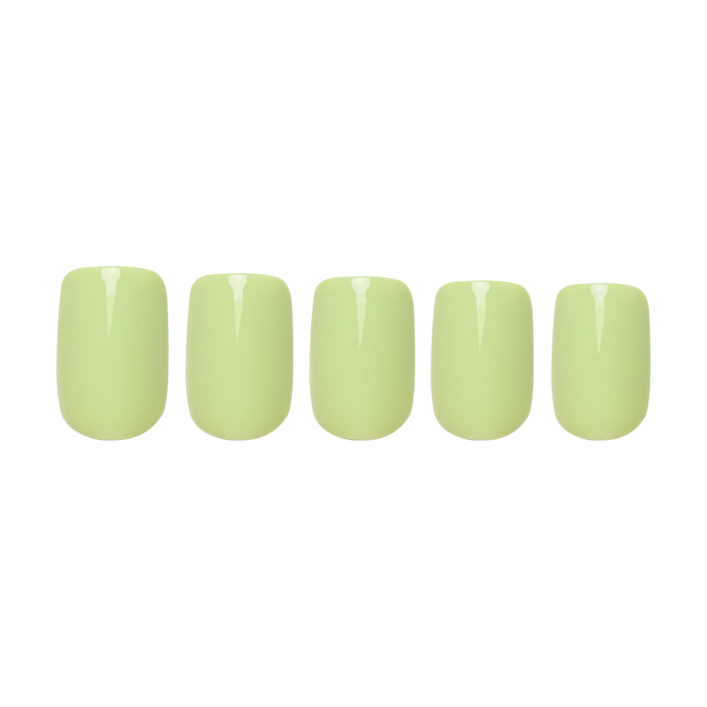 Five glossy pastel light green squoval nails from glamnetic’s Light Sage set are arranged in a row on a white background, highlighting their elegant, flawless finish.