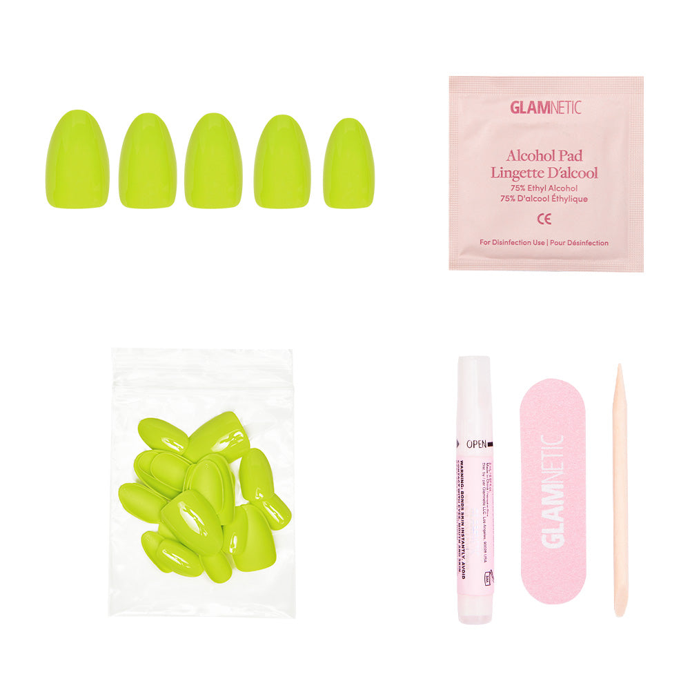 The glamnetic Lime Green set includes neon vegan nails (short oval), an alcohol pad, extra nails, a nail glue pen, a pink file, and a cuticle stick—all displayed on a white background.