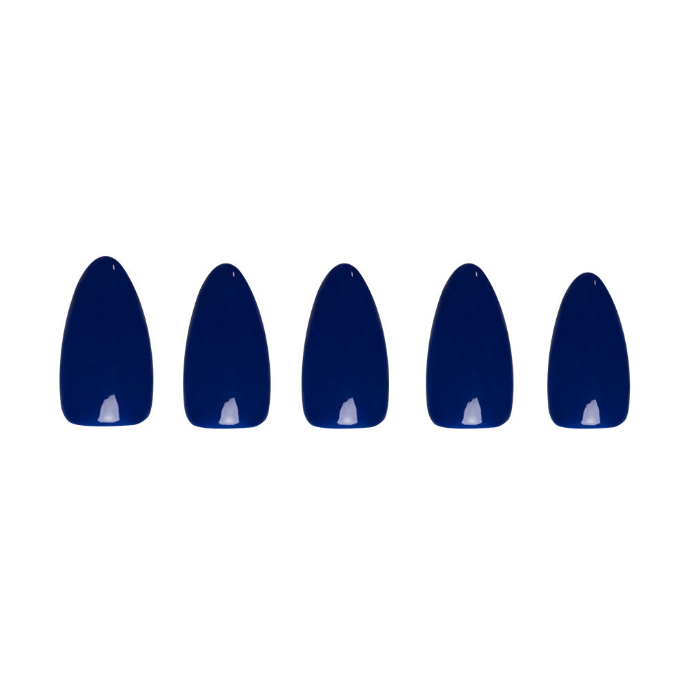 Five dark blue, glossy, oval-shaped false nails from the glamnetic Midnight Blue set are arranged in a row against a white background. This vegan and cruelty-free set evokes the elegance of a fall forest at dusk.