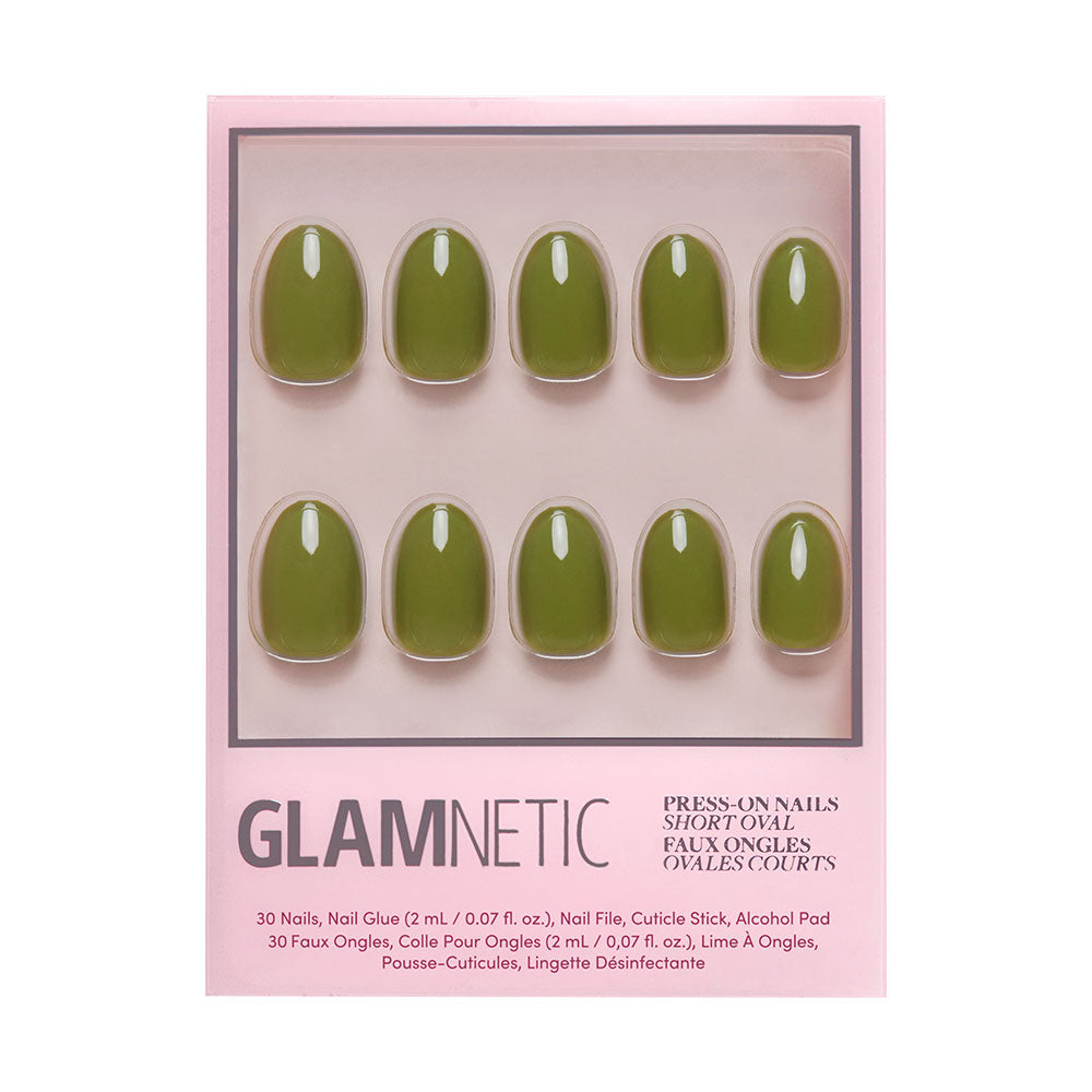 The glamnetic Moss Green Nail Set features oval press-ons in a rich olive shade, displayed in a pink and white box. The kit includes 10 nails in assorted sizes—perfect for embracing fall color trends.