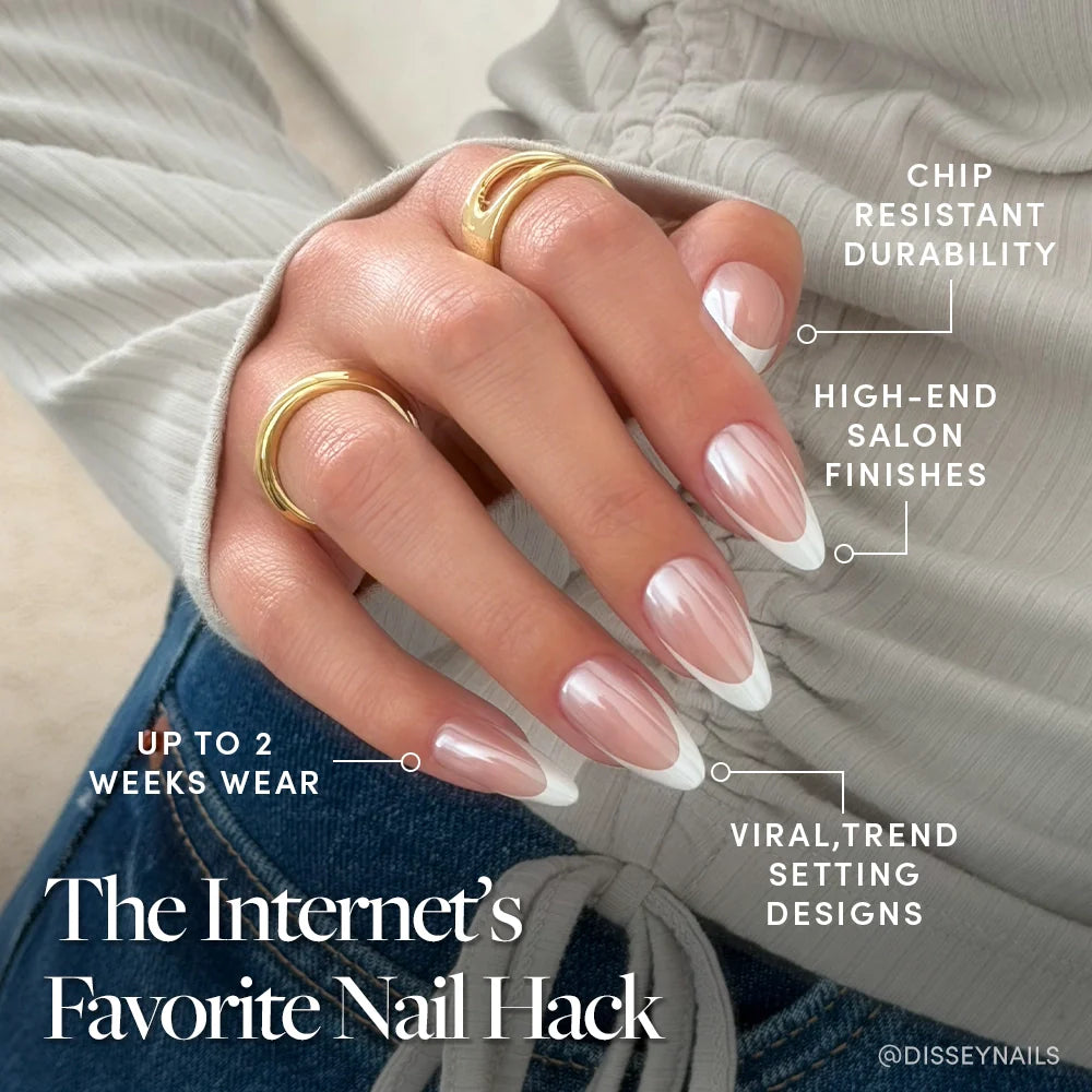 A hand with long, almond-shaped glamnetic Mother Pearl Press-On Nails in a French tip and gold rings is shown. Features: chip resistant, glossy glazed finish, up to 2 weeks wear, and trendy designs. The Internet’s Favorite Nail Hack appears below.