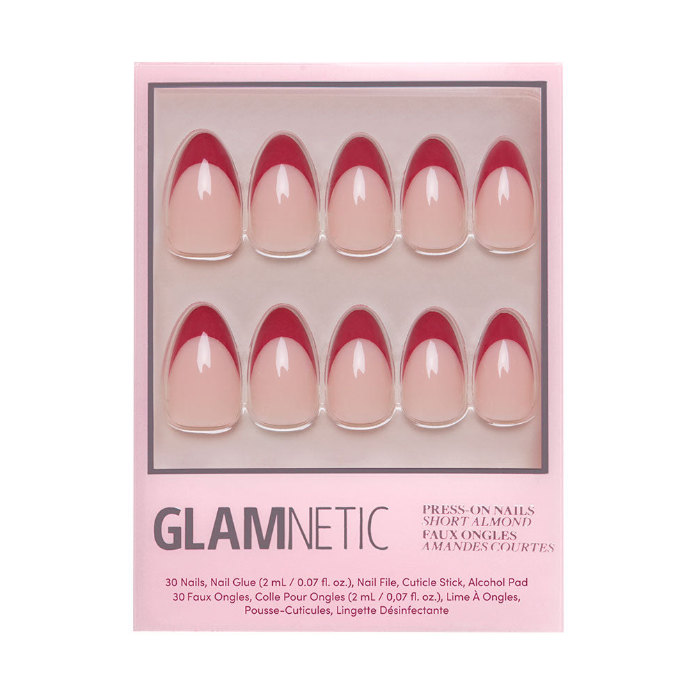 The glamnetic Rose Garden set features 10 short almond nails with a pink base and deep red tips, plus glue, a cuticle stick, and an alcohol pad for easy application.