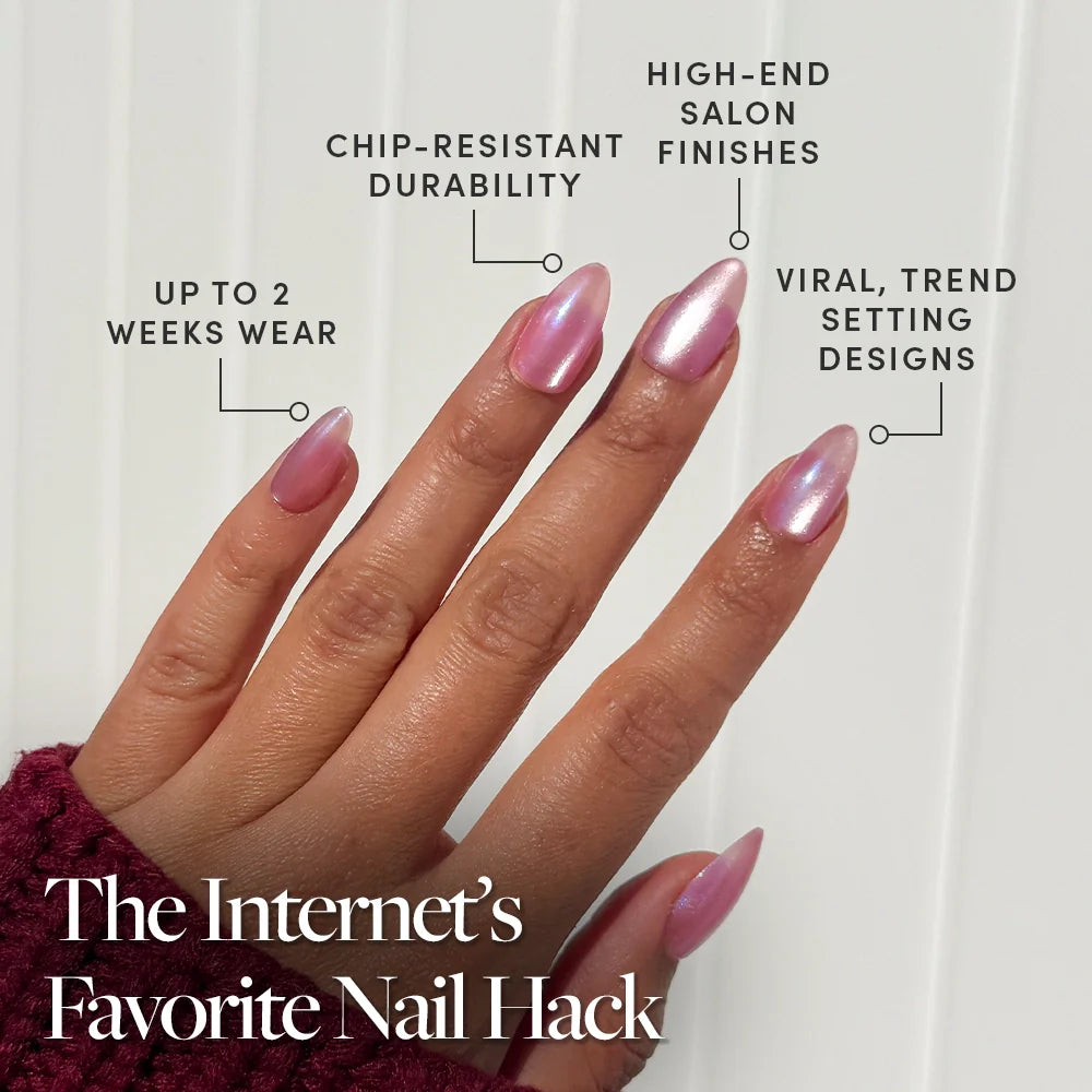 A hand with long, shiny, pink nails is shown. Labels note: up to 2 weeks wear, chip-resistant durability, shimmering velvet finish, and viral designs. Text reads: Seaspell Press-On Nail Set by glamnetic—The Internets Favorite Nail Hack.