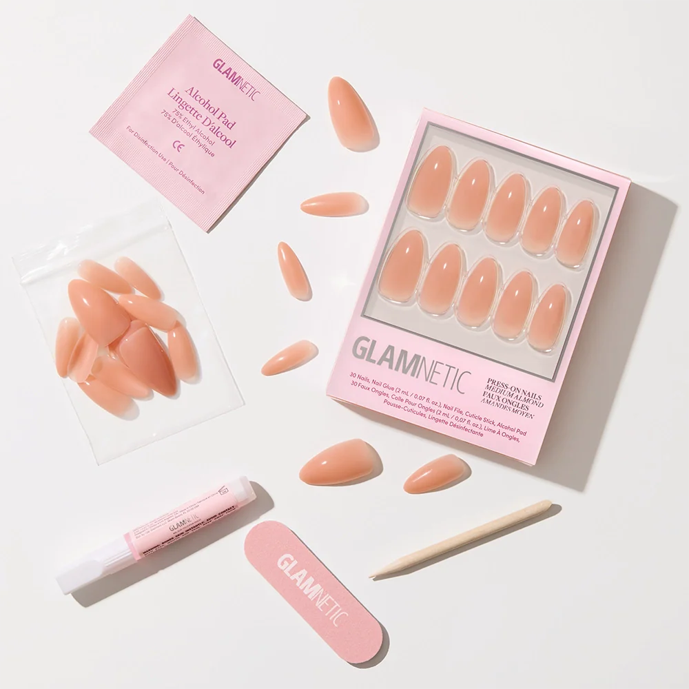 The glamnetic Sheer Peach press-on nails feature a peachy nude, semi-transparent jelly finish and come with a nail file, cuticle stick, glue, alcohol pad, and extra nails, all displayed on a white background.
