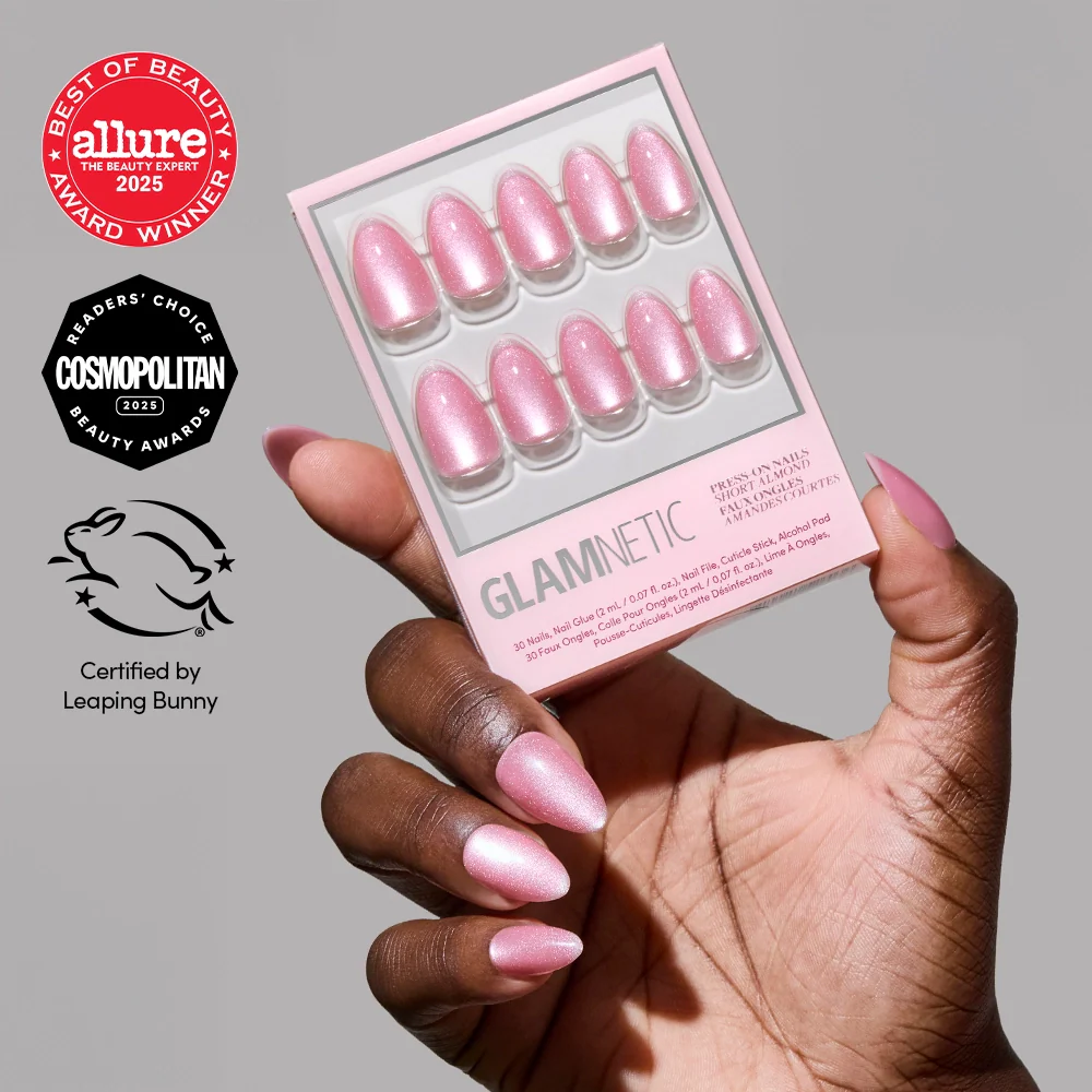 A hand with rosy pink velvet nails in a short almond shape holds the glamnetic Shine for You set. Award badges from Allure and Cosmopolitan, plus Leaping Bunny certification logos, appear on the left side of the image.