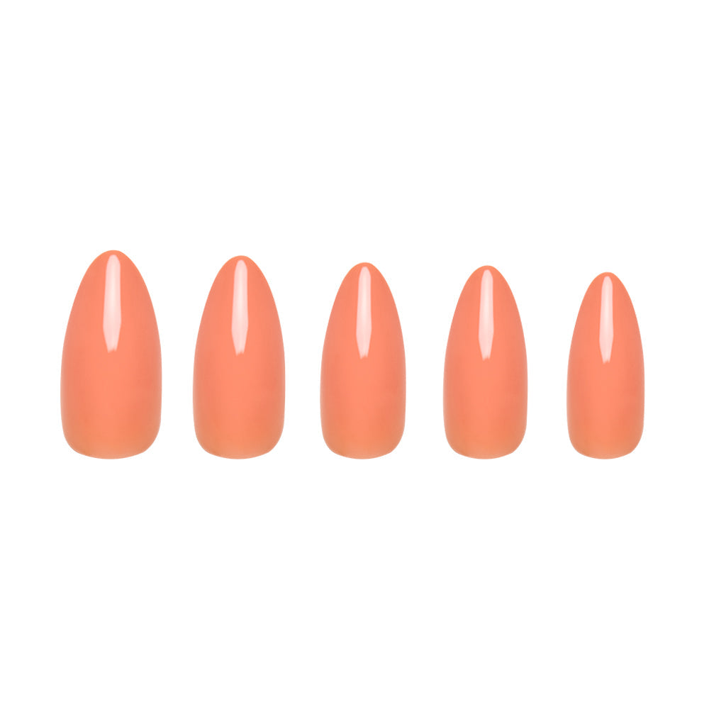Five Soft Tangerine artificial nails by glamnetic, in assorted sizes and a glossy pastel orange shade, are displayed on a white background for a fresh, salon-quality acrylic look.