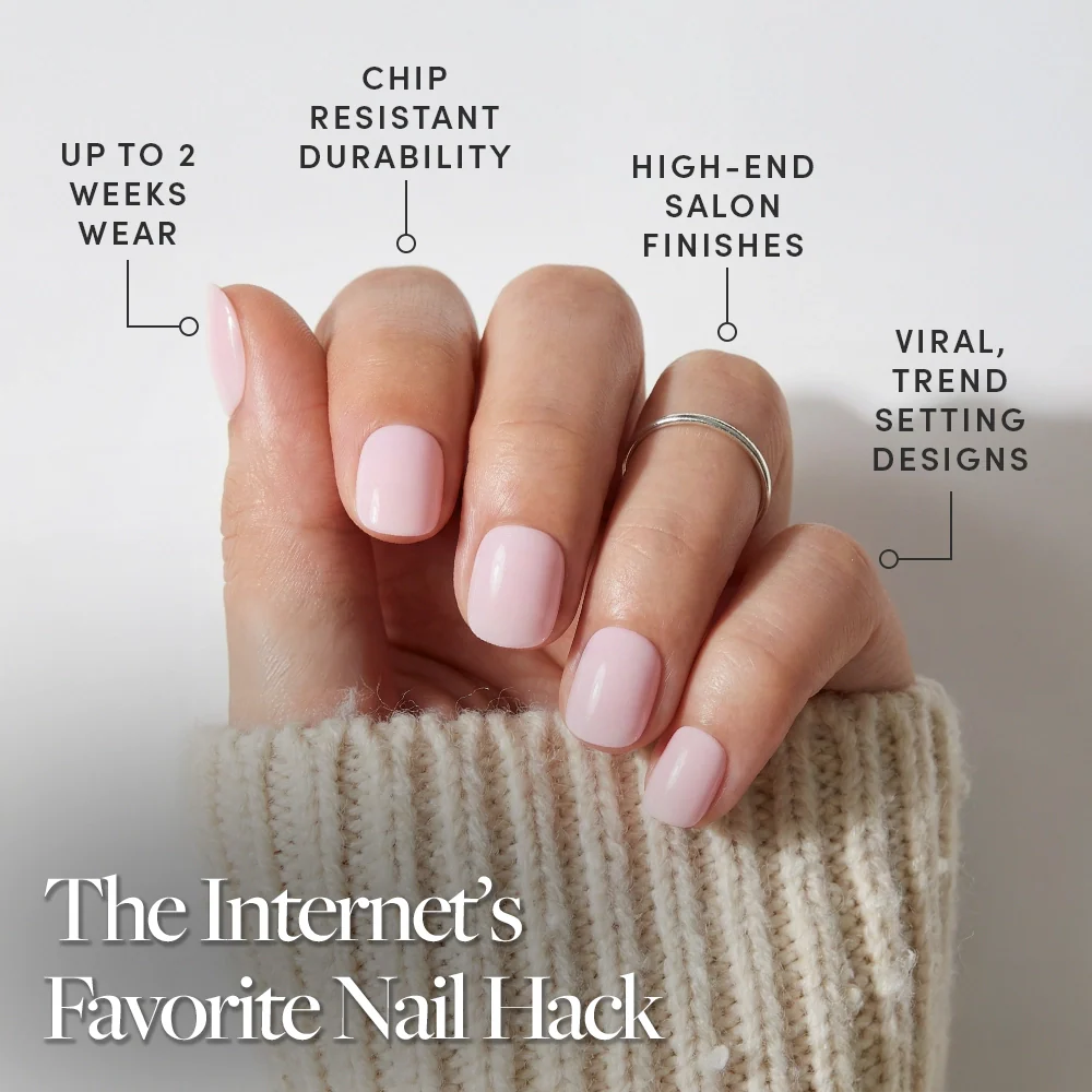 A hand with Sugar BB, glamnetic’s classic pink, glossy press-on nails, rests on a cream knit sleeve. Enjoy up to 2 weeks’ wear, chip-resistant durability, salon-quality finish, and trend-setting styles—The Internet’s Favorite Nail Hack.
