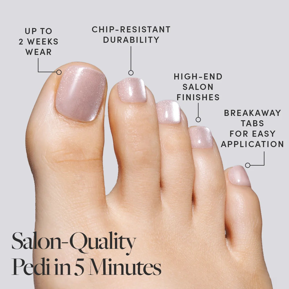 A foot wearing shimmer nude pink Glamnetic press-on toenails, labeled with features like chip-resistance and salon-quality finish.