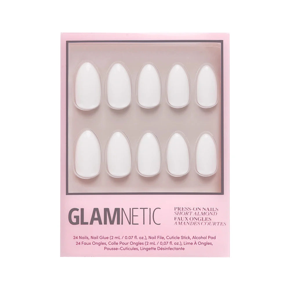 A box of glamnetic Angel vegan press-on nails in a short almond shape. The pink box displays ten white artificial nails through a clear window, with product details printed below.